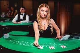 Live dealer studio at situsslot77 with HD cameras, professional lighting, and dealer at Hongkong Pools blackjack table